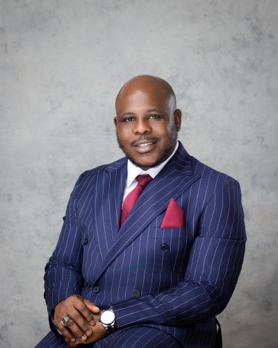 Portrait of Patrick Evbobun, senior leader at Puzz Heritage Financials